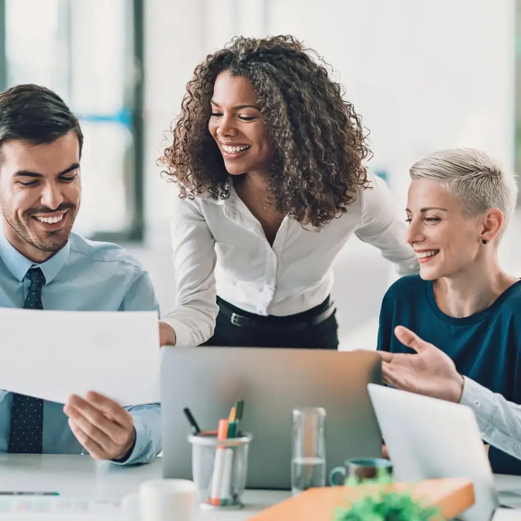 Two professionals collaborating and co-designing workplace wellbeing and leadership strategies.