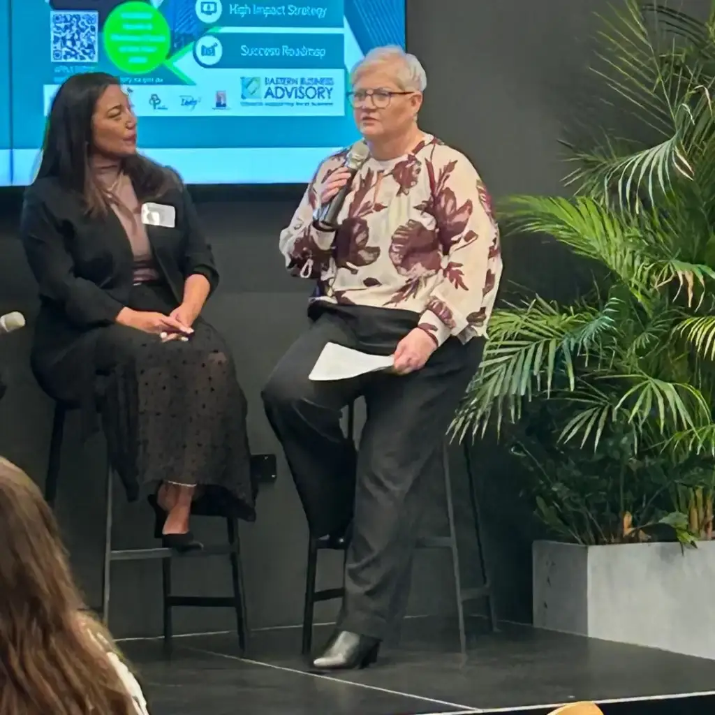 Wellbeing expert Michelle Hasani delivering a keynote on mental health leadership — featured speaker for workplace wellbeing and Mental Health Month 2025.