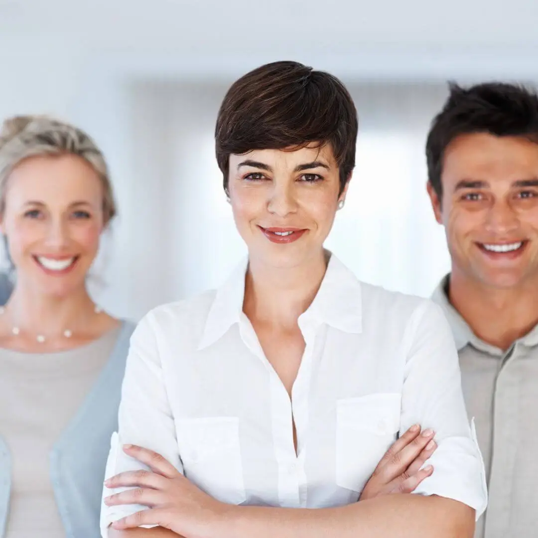 Confident professional standing calmly, symbolising resilience and leadership under pressure.