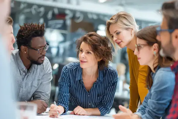 workplace leaders in focused coaching conversation about resilience and wellbeing at work