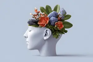 conceptual image of wellbeing and mental fitness represented by flowers blooming from a human head